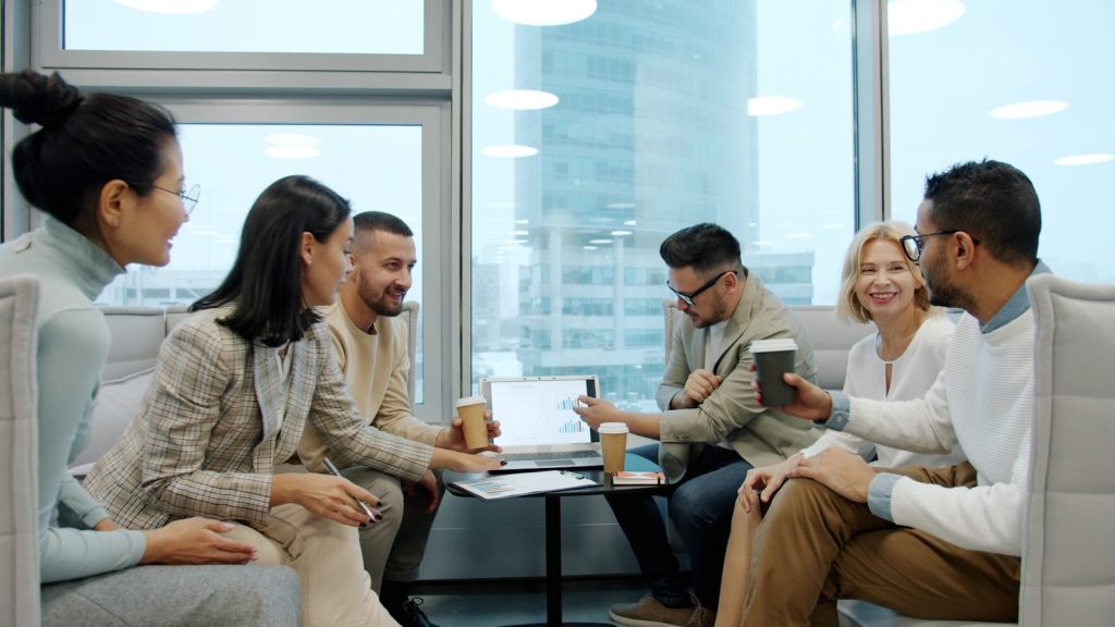 Diverse group of people in a modern office meeting.